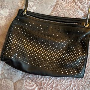 Leather big clutch with studs.